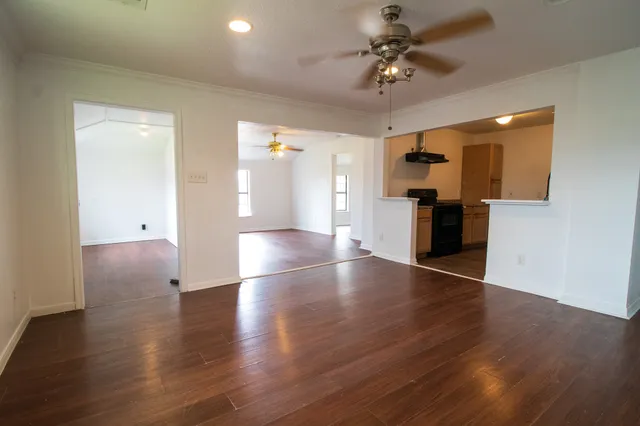 a view of a kitchen with a sink and a stove top oven