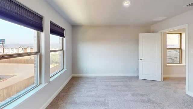 an entryway in a hall with windows