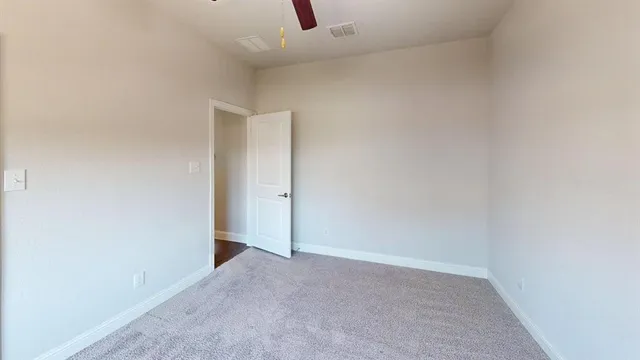 a spacious bathroom with a shower sink and mirror