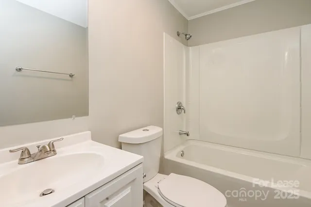 a bathroom with a sink a toilet and a bathtub