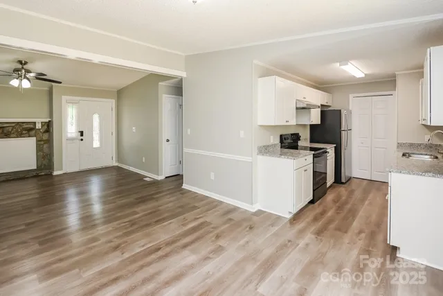 a view of a kitchen with microwave and cabinets