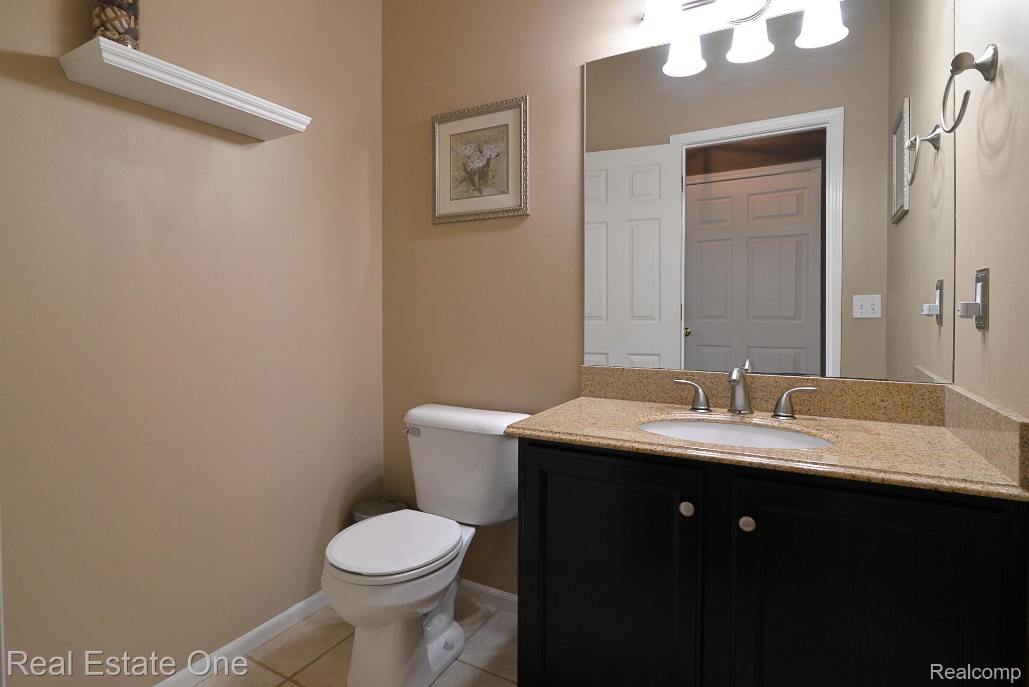 7213 Cowell Road Brighton, MI 48116 - Photo 23 of 64 Half bath off kitchen