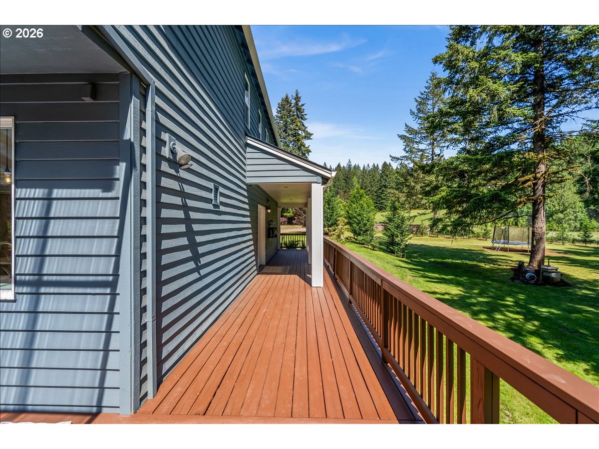 28311 Northwest Nowakowski Road Buxton, OR 97109 - Photo 39 of 48 a view of balcony with wooden floor and fence