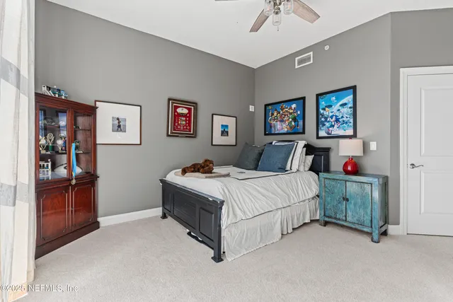 a bed room with a bed and a chandelier