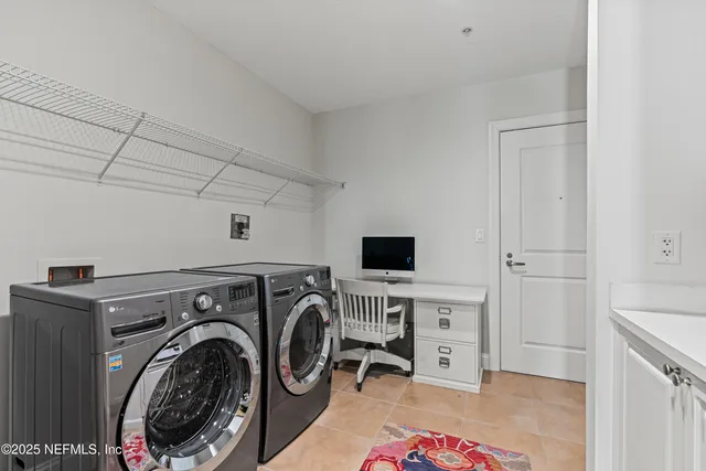 a view of a storage & utility room with washer and dryer