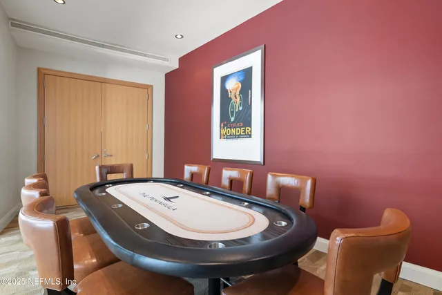 a bathroom with a granite countertop toilet a sink and mirror