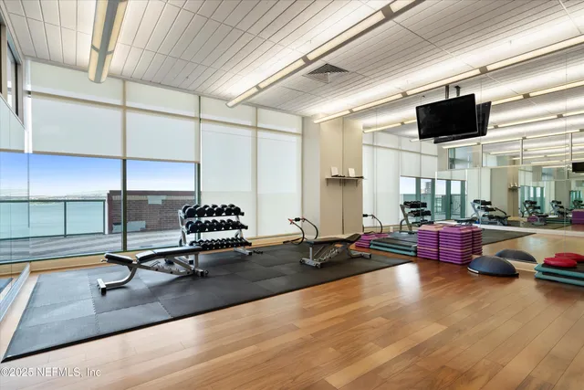 a living room with lots of furniture and a flat screen tv