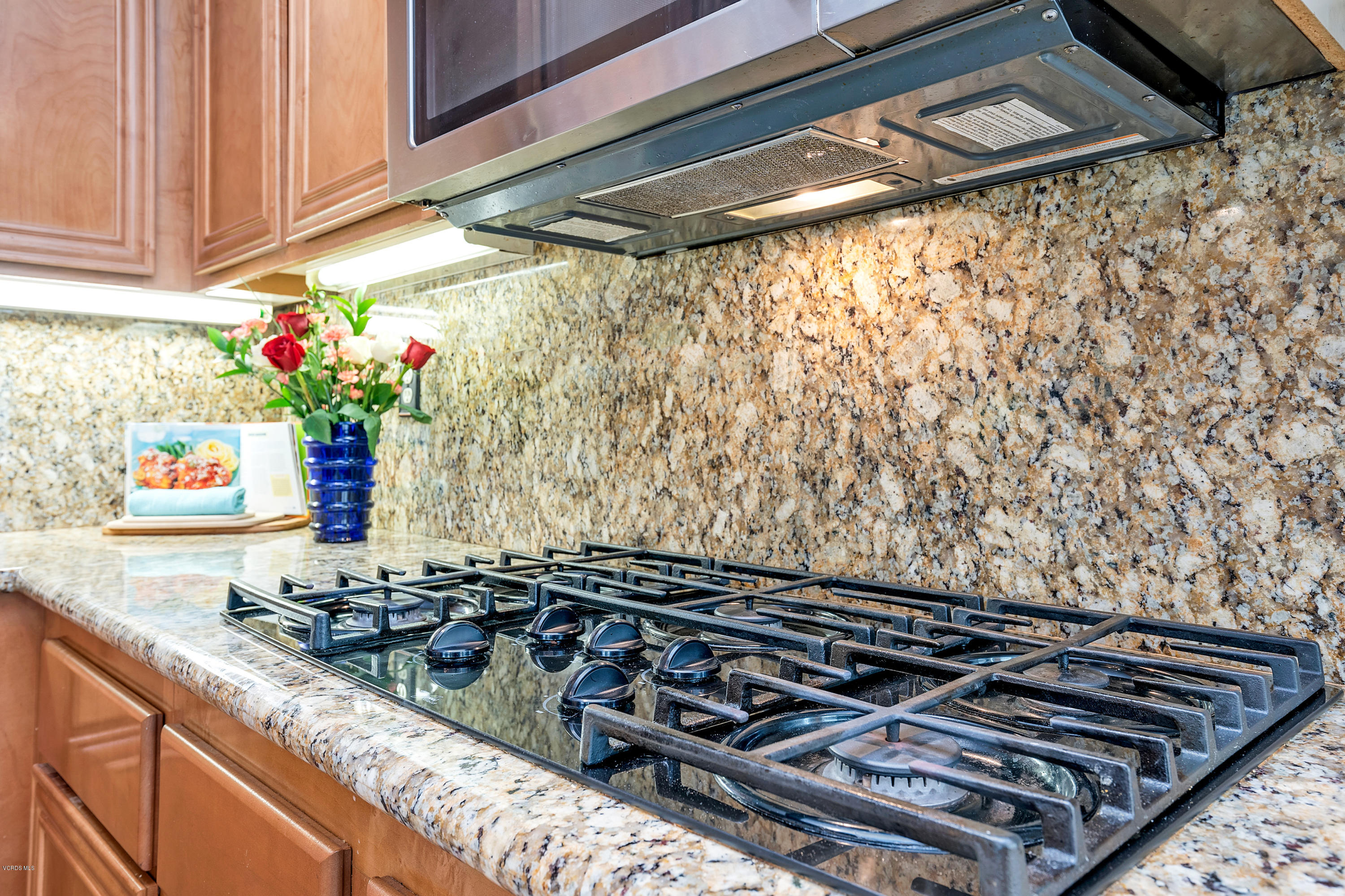 507 Spring Park Road Camarillo, CA 93012 - Photo 11 of 34 a stove top oven sitting inside of a kitchen