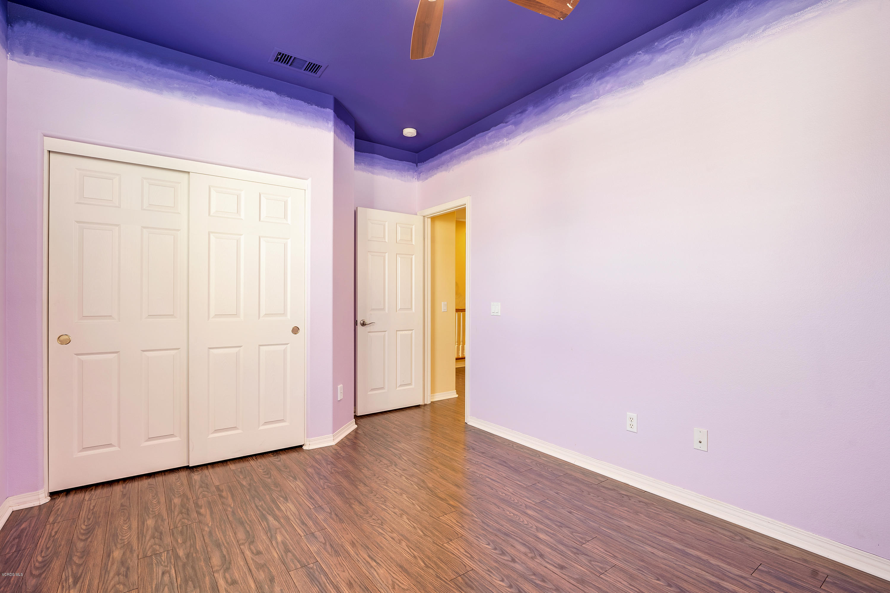 507 Spring Park Road Camarillo, CA 93012 - Photo 17 of 34 a view of an empty room with wooden floor and closet