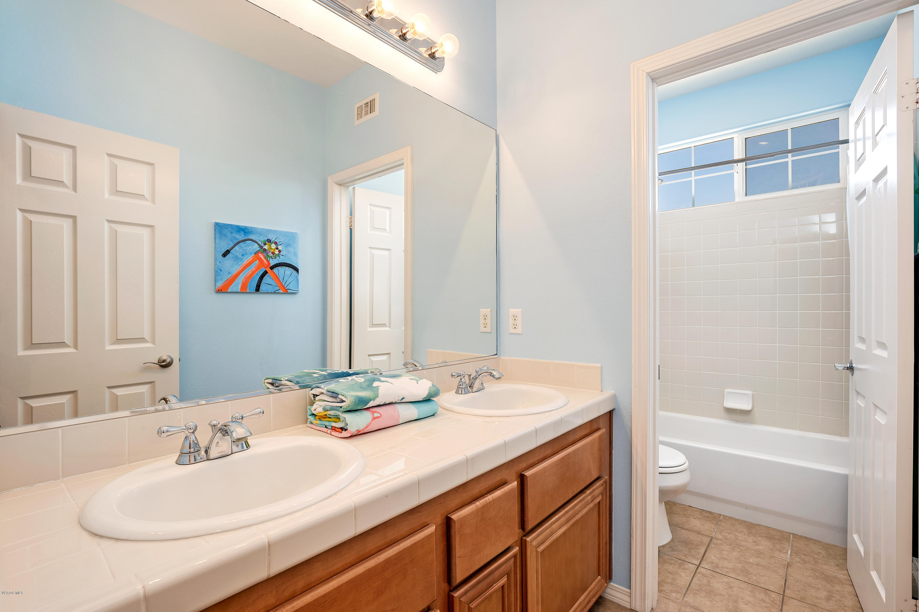 507 Spring Park Road Camarillo, CA 93012 - Photo 18 of 34 a bathroom with a granite countertop sink and a mirror