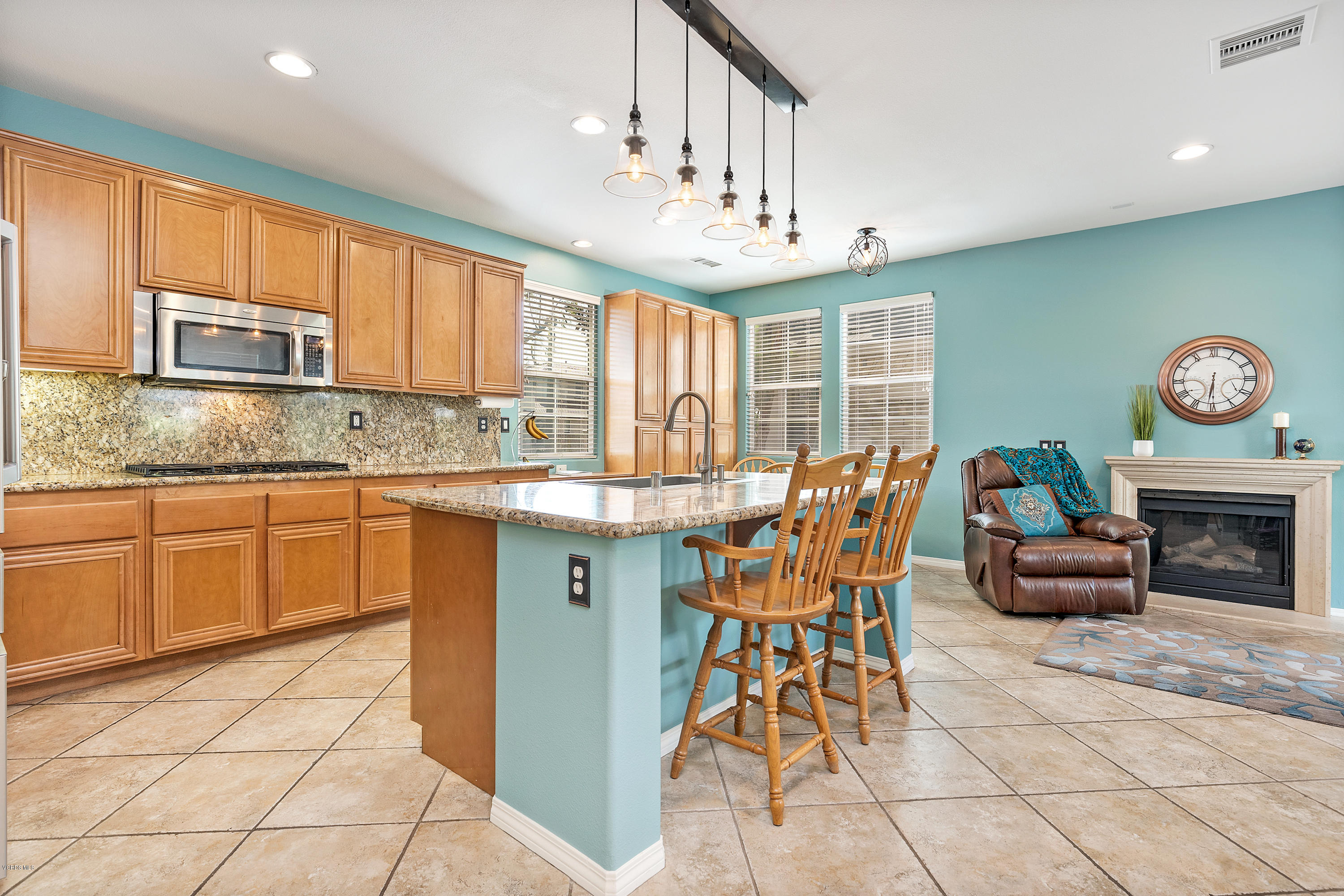 507 Spring Park Road Camarillo, CA 93012 - Photo 3 of 34 a kitchen with stainless steel appliances granite countertop a stove top oven a sink dishwasher and cabinets with a dining table