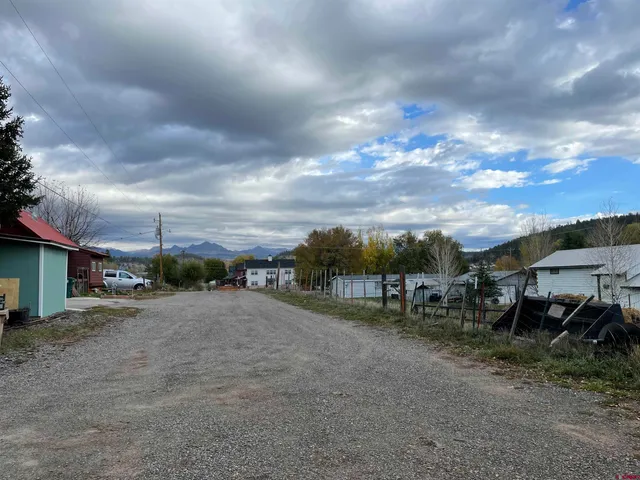 a view of a garden with an outdoor seating