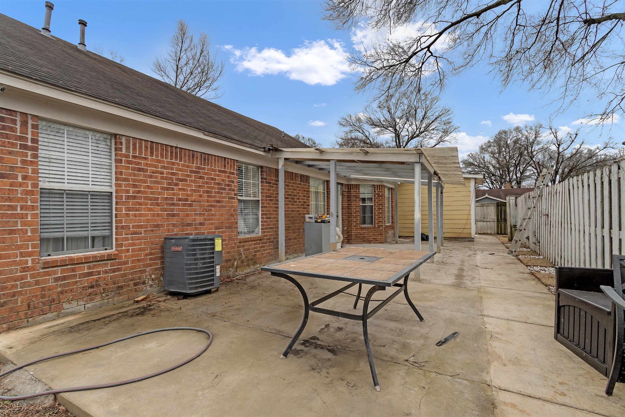 755 North Perkins Road Memphis, TN 38122 - Photo 24 of 25 a backyard of a house with table and chairs