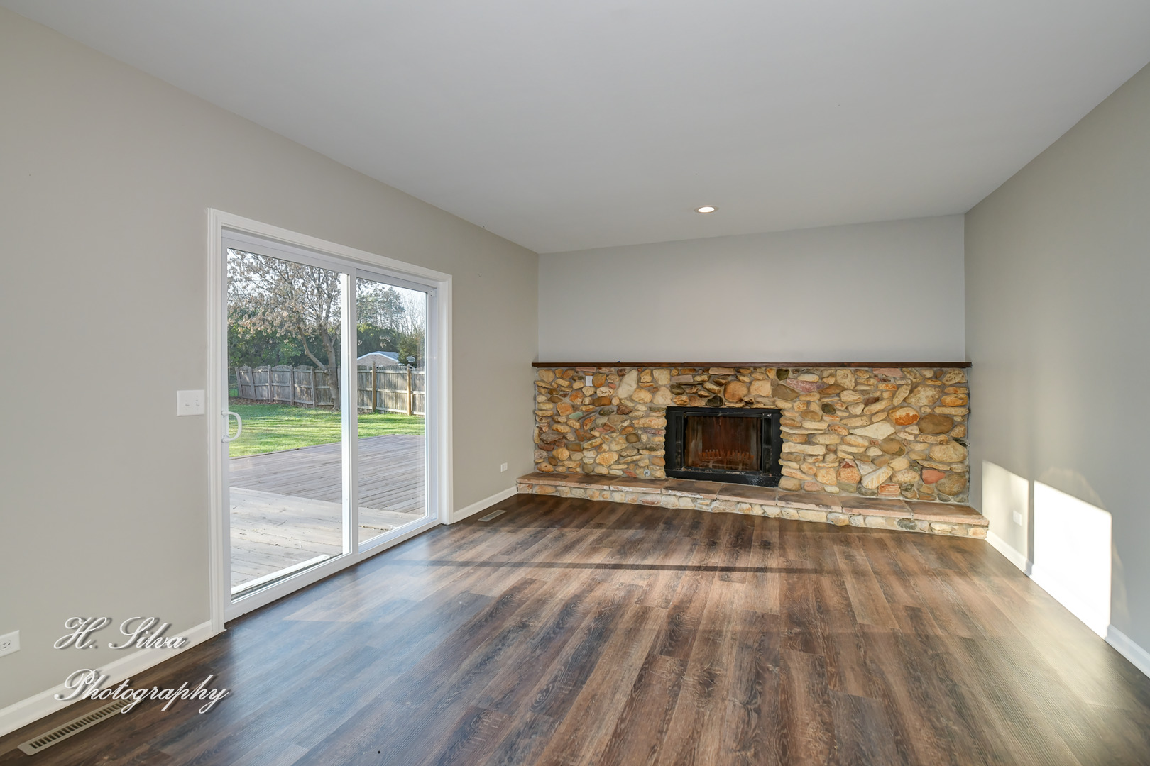 331 Cornell Lane Algonquin, IL 60102 - Photo 12 of 30 wooden floor in an empty room with a fireplace