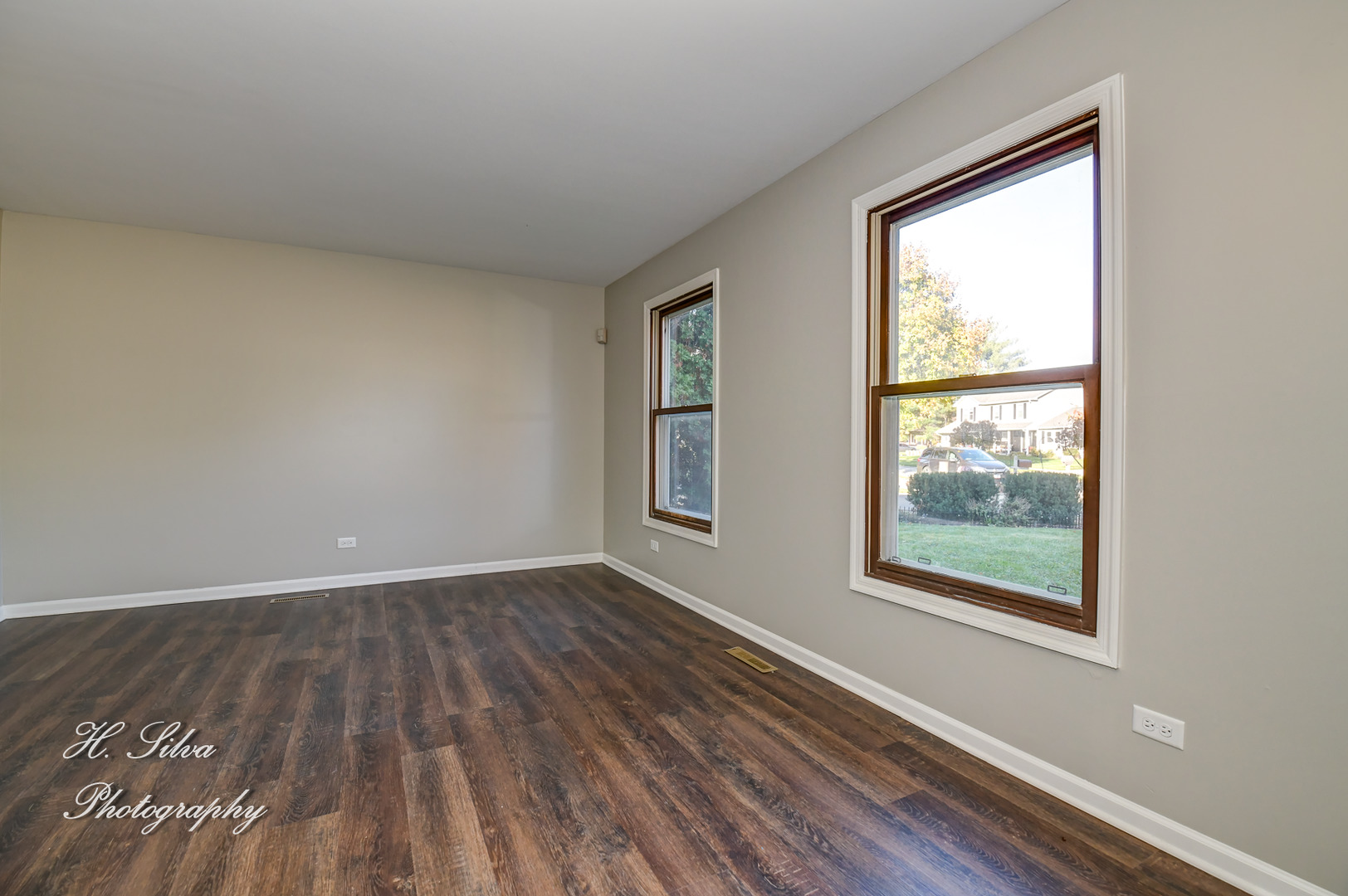331 Cornell Lane Algonquin, IL 60102 - Photo 4 of 30 a view of an empty room with wooden floor and a window