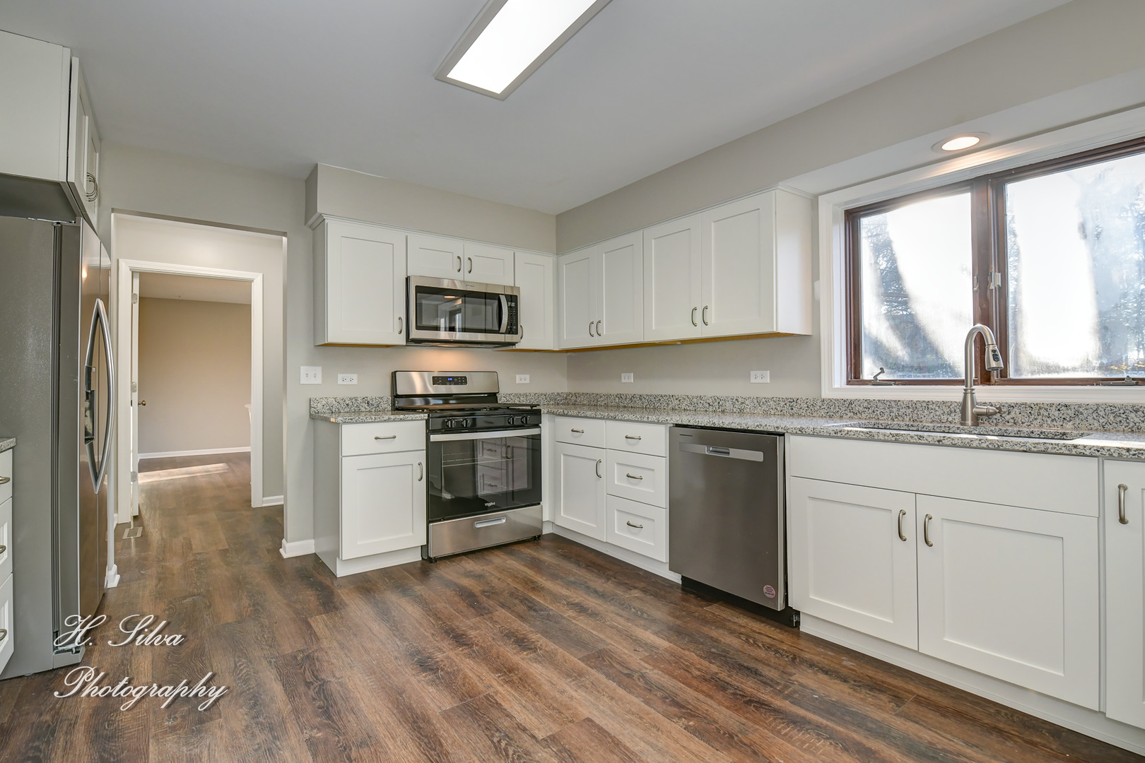 331 Cornell Lane Algonquin, IL 60102 - Photo 8 of 30 a kitchen with granite countertop white cabinets and stainless steel appliances
