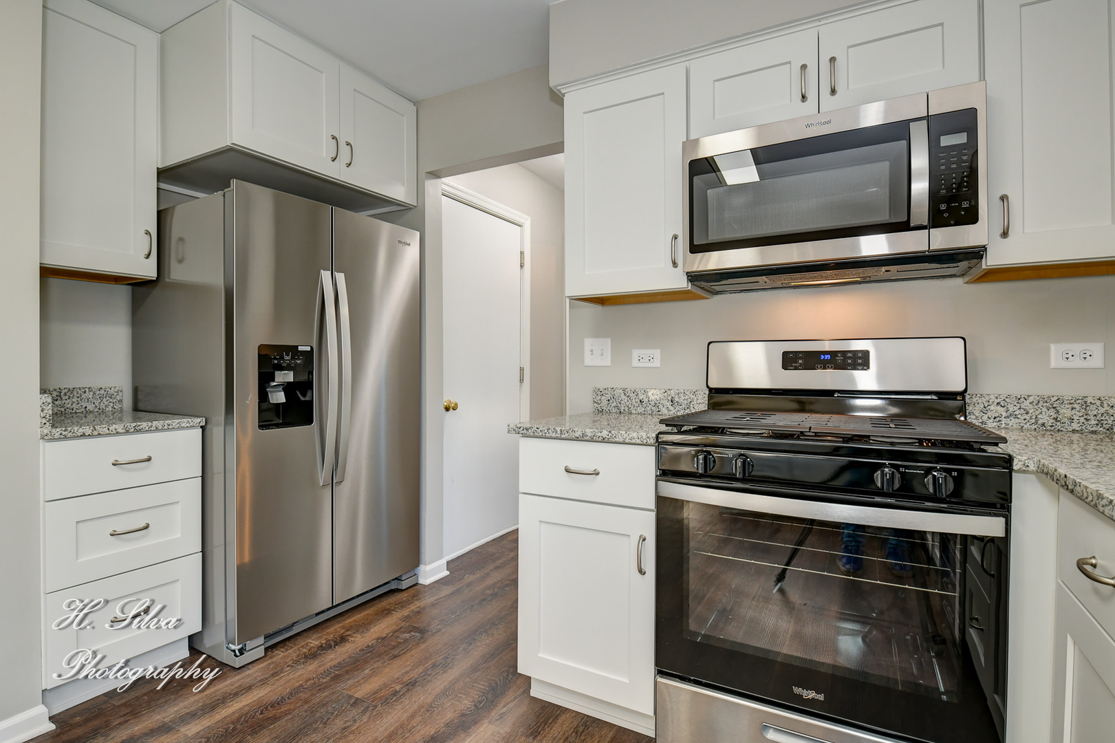 331 Cornell Lane Algonquin, IL 60102 - Photo 10 of 30 a kitchen with stainless steel appliances white cabinets and a stove a refrigerator with wooden floor