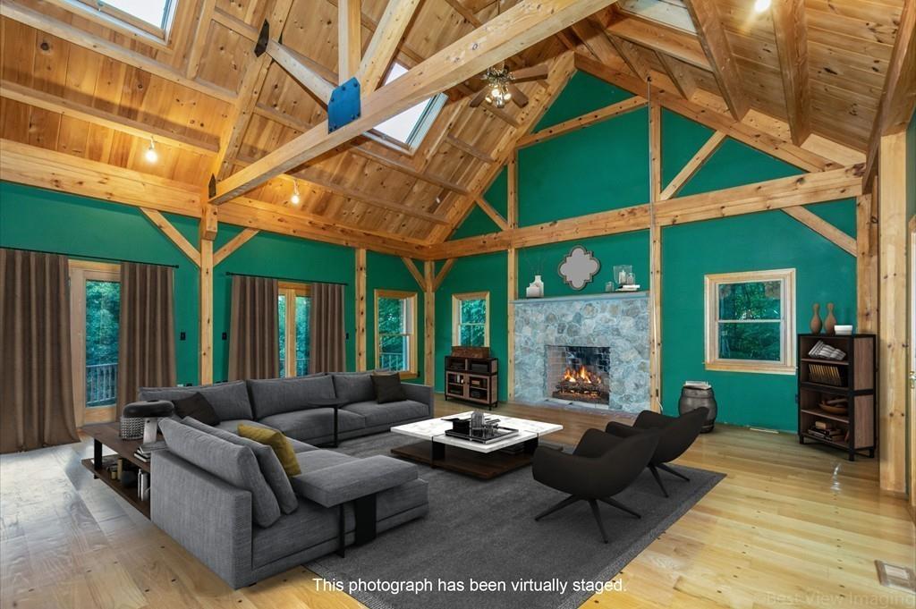 3 Ralph Road Hopkinton, MA 01748 - Photo 11 of 28 a living room with furniture a fireplace and a large window