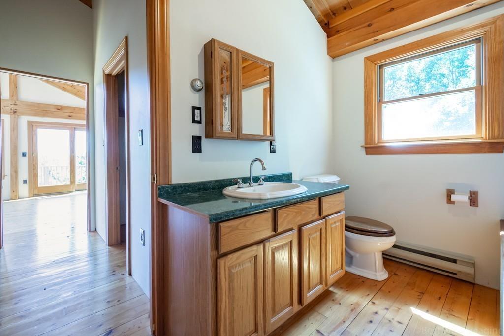 3 Ralph Road Hopkinton, MA 01748 - Photo 15 of 28 a bathroom with a granite countertop sink toilet and mirror