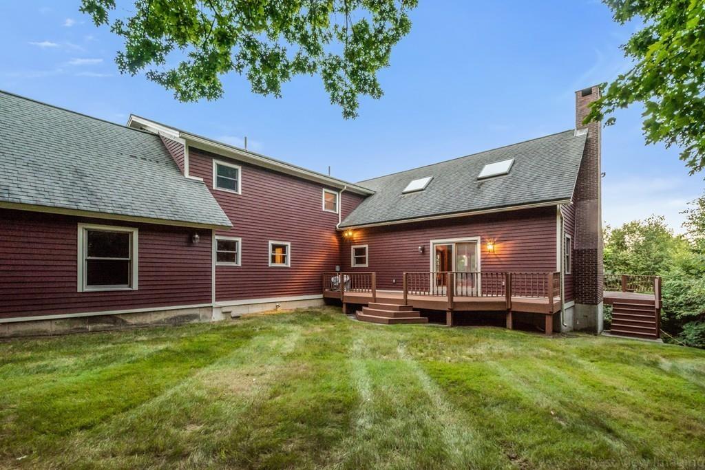 3 Ralph Road Hopkinton, MA 01748 - Photo 26 of 28 a front view of a house with a yard