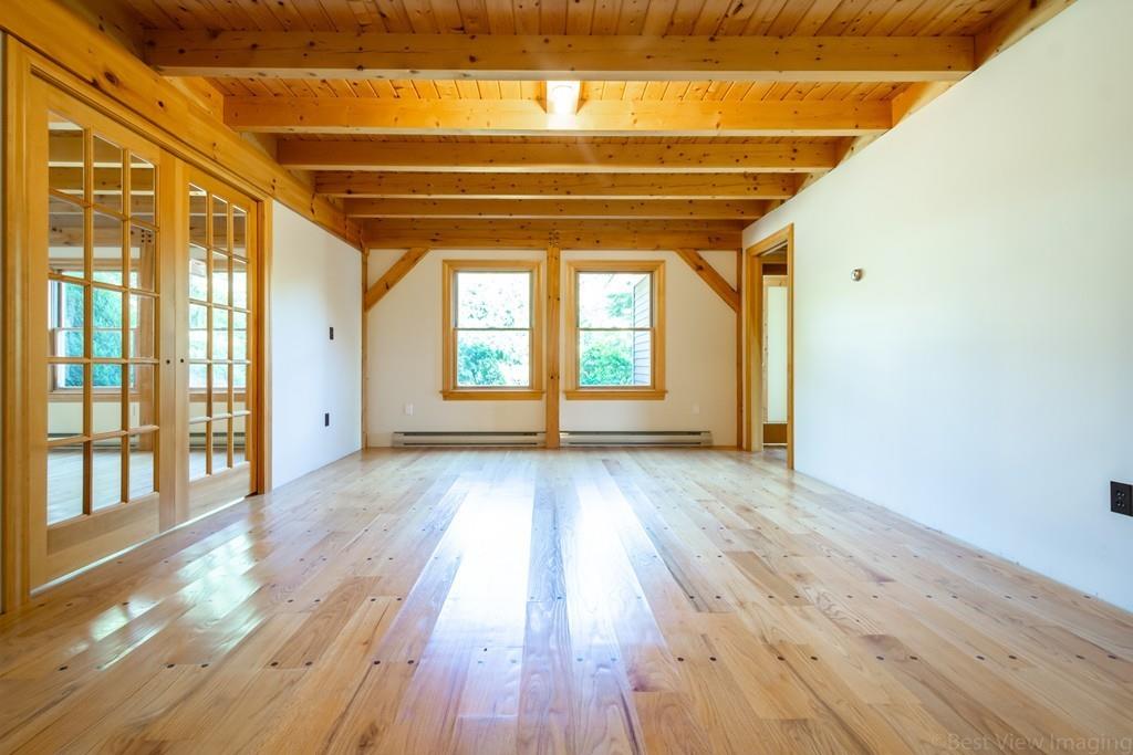 3 Ralph Road Hopkinton, MA 01748 - Photo 3 of 28 a view of empty room with wooden floor and fan
