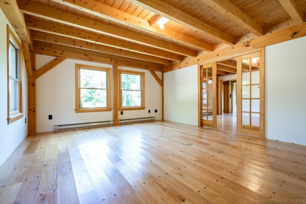 3 Ralph Road Hopkinton, MA 01748 - Photo 5 of 28 a view of empty room with wooden floor and fan