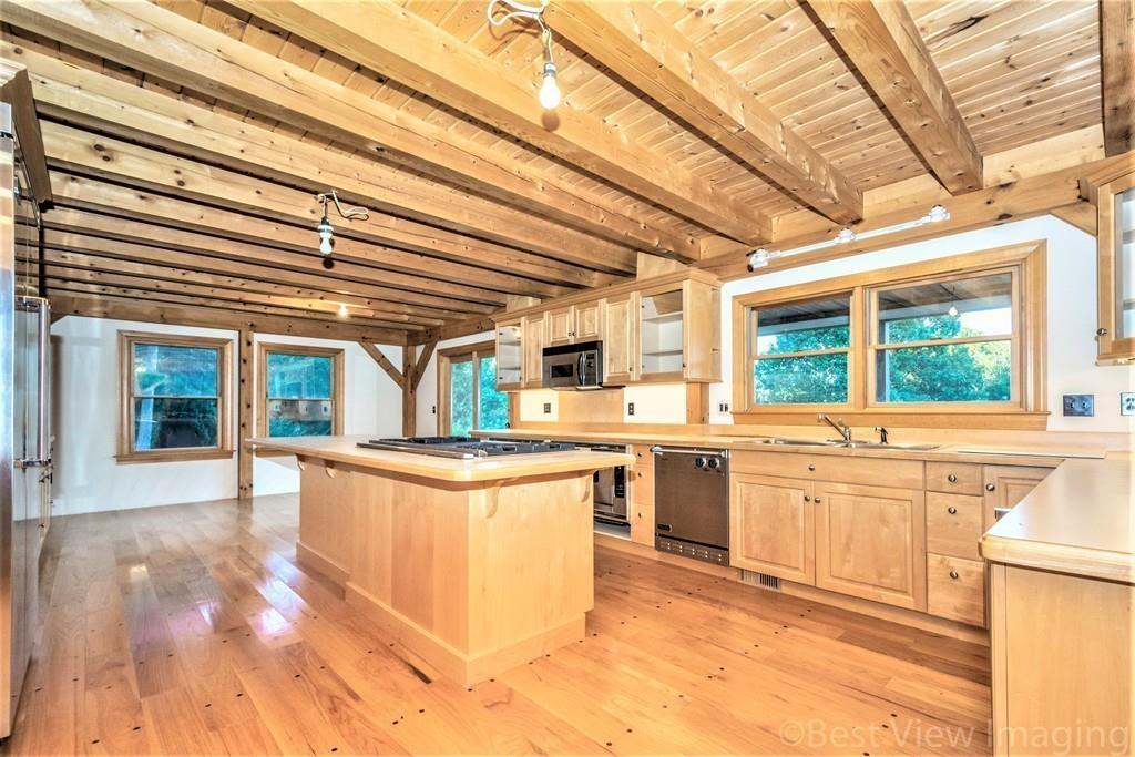 3 Ralph Road Hopkinton, MA 01748 - Photo 6 of 28 a kitchen with stainless steel appliances granite countertop a sink and wooden cabinets