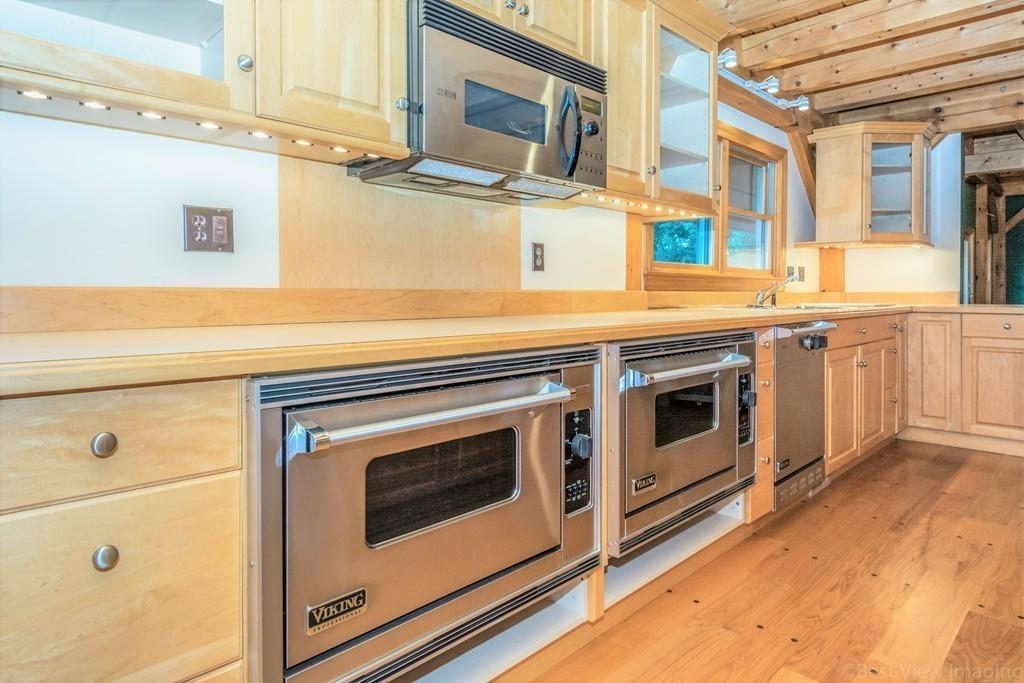 3 Ralph Road Hopkinton, MA 01748 - Photo 7 of 28 a stove top oven sitting inside of a kitchen