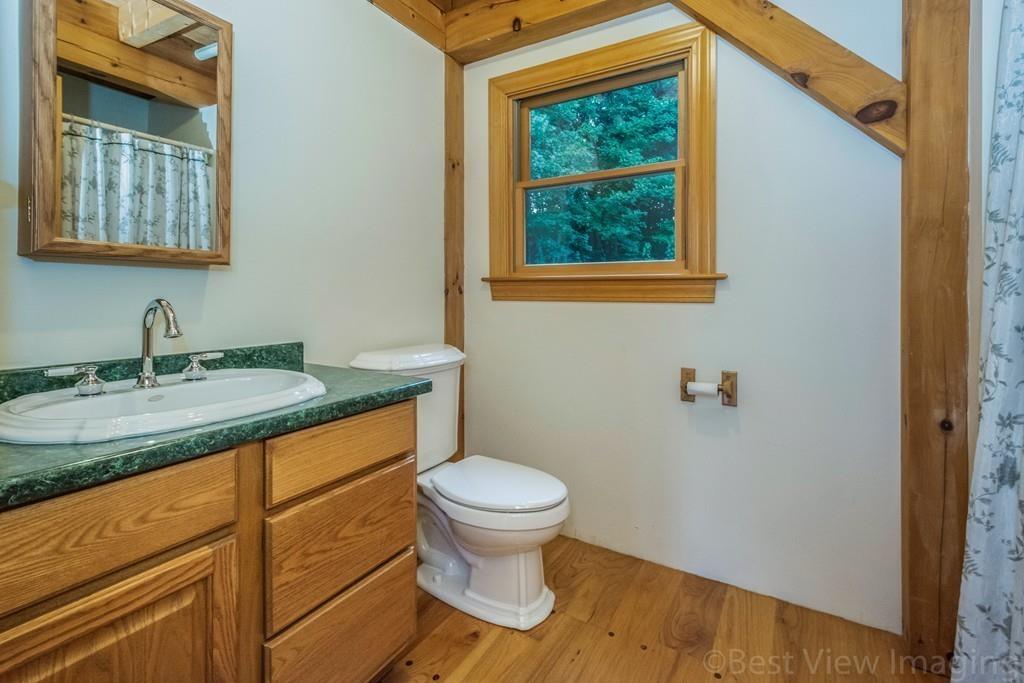 3 Ralph Road Hopkinton, MA 01748 - Photo 10 of 28 a bathroom with a granite countertop toilet sink and mirror