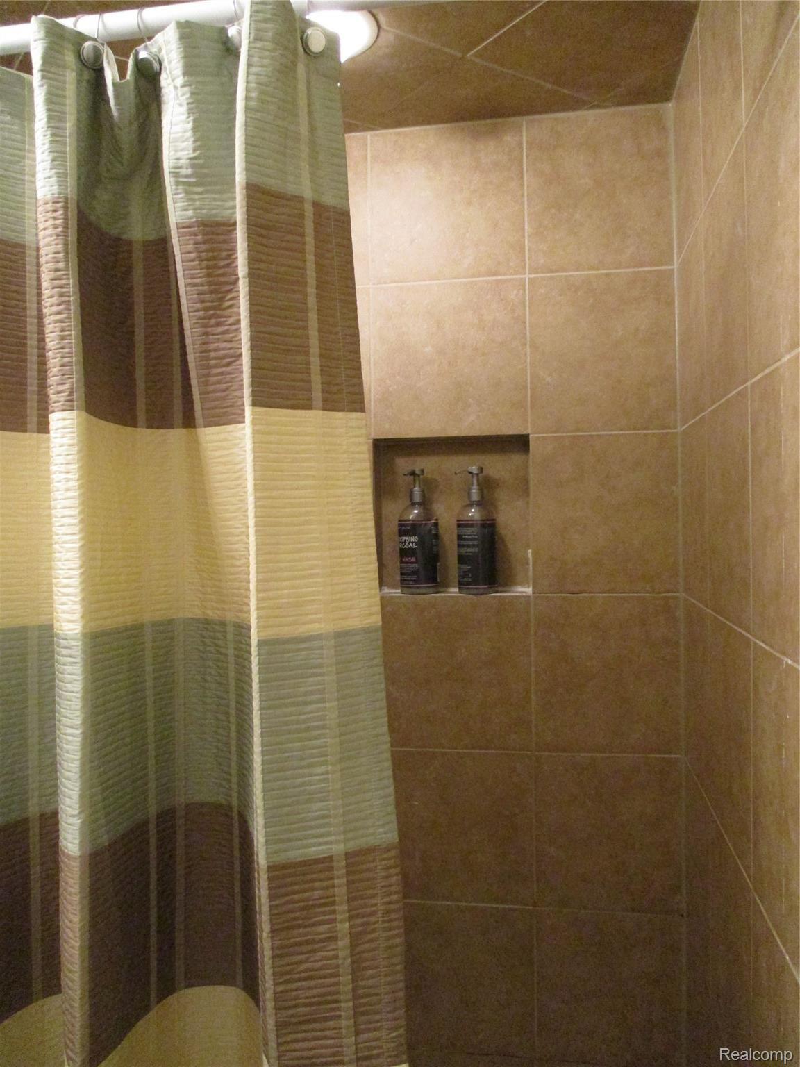 19215 Inkster Road Livonia, MI 48152 - Photo 29 of 43 MASTER BATH SHOWER CERAMIC TILE