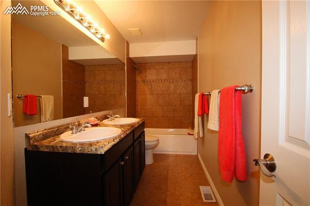 5224 Rondo Way Colorado Springs, CO 80911 - Photo 23 of 36 Upper full bath with double vanity.