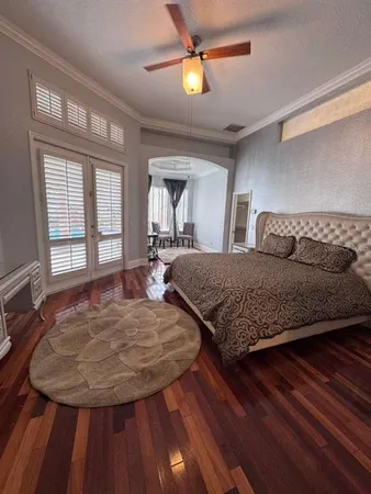 a bedroom with a bed and window