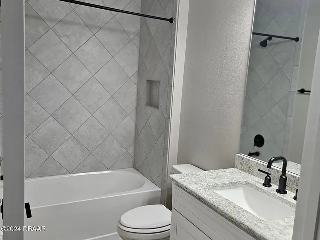 a view of swimming pool with a yard in front of it