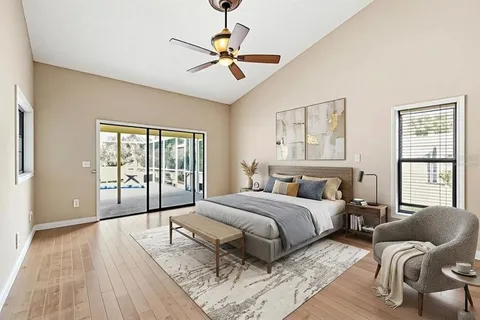 a bedroom with a large bed and a large window