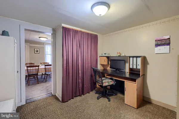 a view of a workspace with furniture