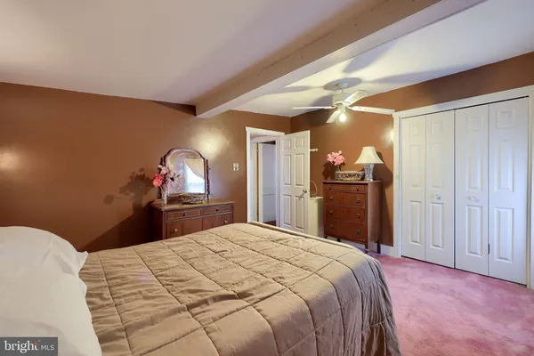 a bedroom with a bed and a closet