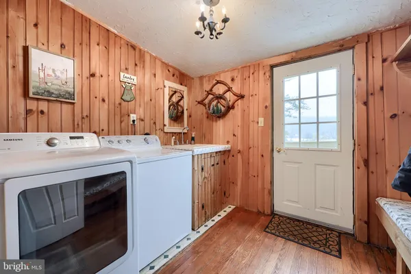 a bathroom with a sink a mirror and a shower