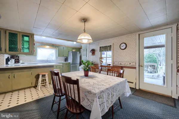 a dining room with furniture window wooden floor