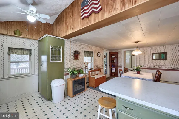 a kitchen with a stove a sink and a refrigerator