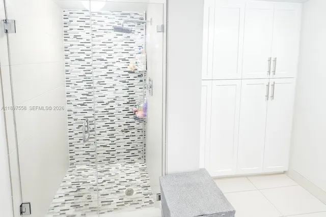 a view of a dining room with furniture and a book shelf