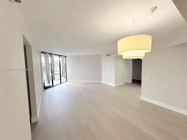 a kitchen with a sink a stove and cabinets