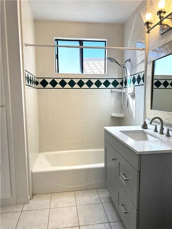 a bathroom with a bathtub and a sink