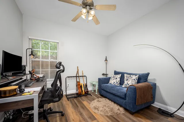 a bedroom with furniture and a window
