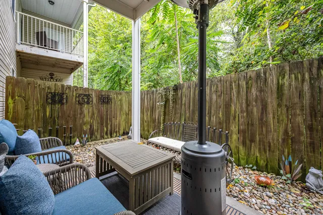 a table and chairs sitting in front of a house