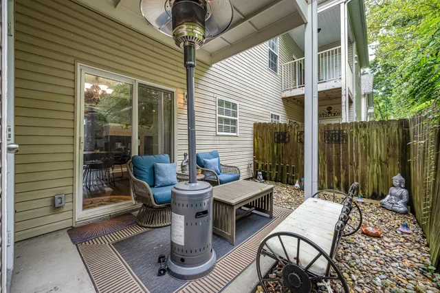 a backyard of a house with outdoor seating