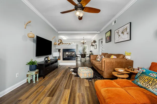 a living room with fireplace furniture and a flat screen tv