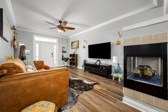a living room with furniture and a flat screen tv