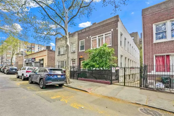 a view of a cars parked in front of a building