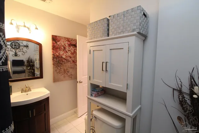 a bathroom with a sink a mirror and a toilet