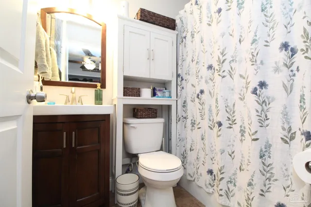 a bathroom with a toilet and a sink